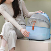Breathable Pet Space Capsule Backpack - Light blue backpack with front-facing mesh window, open-top design for easy access