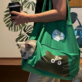 Cute green portable cat canvas carrier bag with peeking cat design, soft polyester-cotton material for cozy pet travel