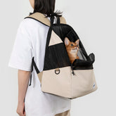 Lightweight pet travel backpack with front-facing mesh window, holds cats/small dogs, breathable design, dual-use tote style.