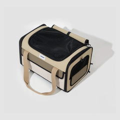 The carrier with fabric covers rolled back, showing the top and side mesh panels.