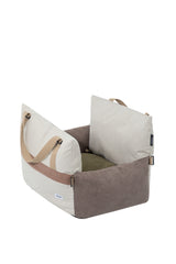 Brown and cream pet car seat bed with raised padded sides, carry handles and an olive-green cushion.